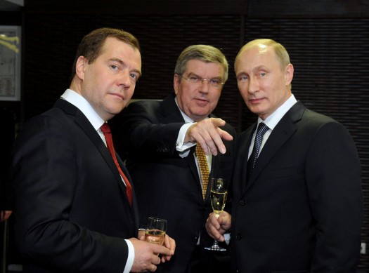 Russia's President Putin, Prime Minister Medvedev and International Olympic Committee (IOC) President Bach of Germany speak before the closing ceremony for the 2014 Sochi Winter Olympics